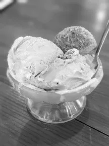 A glass dish of homemade chocolate ice cream